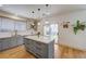 Stylish kitchen with hardwood floors, gray cabinets, and a view to the backyard at 189 Andada Dr, Henderson, NV 89012