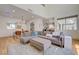 Inviting living room with a sectional sofa, dining area, and an open floor plan at 189 Andada Dr, Henderson, NV 89012