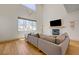 Bright living room boasts fireplace, large windows, and modern flooring for a cozy atmosphere at 189 Andada Dr, Henderson, NV 89012