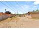 A spacious back yard with block fencing and some desert landscaping at 1901 Manhattan Dr, Las Vegas, NV 89106