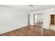 Bedroom featuring wood-look floors, light walls, closet, and adjacent bathroom at 1901 Manhattan Dr, Las Vegas, NV 89106