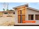 Rendering showing a home with a light brick facade and large windows at 1901 Manhattan Dr, Las Vegas, NV 89106