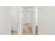 Bright hallway with tiled floors and neutral walls leading to various rooms in the home at 1901 Manhattan Dr, Las Vegas, NV 89106