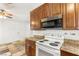 Efficient kitchen featuring stainless steel appliances and warm wood cabinetry at 1901 Manhattan Dr, Las Vegas, NV 89106