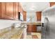Functional kitchen featuring stainless steel appliances, granite countertops, and warm wood cabinetry at 1901 Manhattan Dr, Las Vegas, NV 89106