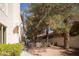Side yard with gravel, sparse greenery, a pathway, and fence at 2041 Troon Dr, Henderson, NV 89074