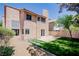 Home with well-maintained backyard, manicured lawn, patio, and privacy landscaping at 2204 Brighton Shore St, Las Vegas, NV 89128