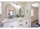 A bathroom features dual sinks with modern fixtures and mirrors at 2204 Brighton Shore St, Las Vegas, NV 89128