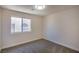 Cozy bedroom with neutral carpet and walls with bright natural light from the window at 2204 Brighton Shore St, Las Vegas, NV 89128