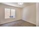 Neutral bedroom with carpet and view of window at 2204 Brighton Shore St, Las Vegas, NV 89128