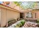 Inviting front entrance with desert landscaping leading to an arched window and tiled roof at 2204 Brighton Shore St, Las Vegas, NV 89128