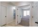 Hallway leading to a bathroom with updated features and a carpeted bedroom at 2204 Brighton Shore St, Las Vegas, NV 89128