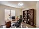 Spacious office features a built-in bookcase, desk, and a comfortable executive chair at 2204 Brighton Shore St, Las Vegas, NV 89128
