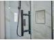 Modern shower with marble-patterned tiles, frameless glass door, matte black fixtures, and a built-in niche at 2204 Brighton Shore St, Las Vegas, NV 89128