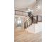 Modern staircase with black railing, leading to the second floor and hallway with luxury vinyl plank flooring at 2204 Brighton Shore St, Las Vegas, NV 89128