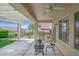 Covered patio with ceiling fan, exterior kitchen, and space for outdoor dining at 2385 Orangeburg Pl, Henderson, NV 89044