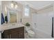 Bathroom features updated vanity, faucet, toilet, bathtub and shower combo at 2385 Orangeburg Pl, Henderson, NV 89044