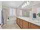 Bathroom features a double sink vanity, garden tub, and separate shower at 2385 Orangeburg Pl, Henderson, NV 89044
