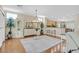 Open-concept dining area with hardwood floors and a decorative chandelier at 2385 Orangeburg Pl, Henderson, NV 89044