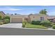 Charming single-story home with a well-manicured lawn and attached two-car garage at 2385 Orangeburg Pl, Henderson, NV 89044