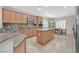 Spacious kitchen with granite countertops, stainless steel appliances, and wood cabinets at 2385 Orangeburg Pl, Henderson, NV 89044