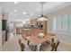 Open-concept kitchen featuring an island, stainless steel appliances, and tile flooring at 2385 Orangeburg Pl, Henderson, NV 89044