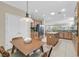 Spacious kitchen boasts an island, stainless steel appliances, and tile flooring at 2385 Orangeburg Pl, Henderson, NV 89044