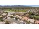 Aerial perspective showcasing neighborhood with desert landscaping, community parks, and scenic mountain backdrop at 2475 Sedona Cedar Ave, Henderson, NV 89052