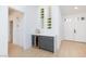 Stylish bar area with a wine fridge, custom cabinets, and marble countertops at 2475 Sedona Cedar Ave, Henderson, NV 89052