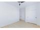 Minimalist bedroom with wood floors, ceiling fan, and neutral paint at 2475 Sedona Cedar Ave, Henderson, NV 89052