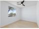 Bright, airy bedroom with a ceiling fan and large window overlooking the neighborhood at 2475 Sedona Cedar Ave, Henderson, NV 89052
