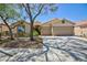 Charming single-story home featuring a two-car garage and xeriscaped front yard at 2475 Sedona Cedar Ave, Henderson, NV 89052