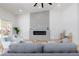 Cozy living room with a modern fireplace and seating area perfect for relaxation at 2475 Sedona Cedar Ave, Henderson, NV 89052