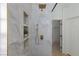 Contemporary shower showcasing marble tiling, gold fixtures, and built-in shelving niches at 2475 Sedona Cedar Ave, Henderson, NV 89052