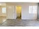 Open living space with wood-look floors and a laundry room with a washing machine at 2705 Jennydiane Dr, Las Vegas, NV 89121