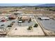Aerial view of a desert property showcasing the home, surrounding land, and outbuildings at 2730 Banyon St, Pahrump, NV 89048