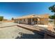 Large backyard features a patio, gravel landscaping, and privacy fencing at 2730 Banyon St, Pahrump, NV 89048