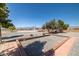 Spacious backyard with gravel landscaping and mature trees offering ample space at 2730 Banyon St, Pahrump, NV 89048