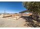 Backyard with car port area with gravel landscaping providing ample parking space at 2730 Banyon St, Pahrump, NV 89048