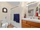 Bright bathroom featuring a shower-tub combo and a wood vanity at 2730 Banyon St, Pahrump, NV 89048
