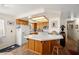 Bright kitchen with tile counters, wooden cabinets, and modern appliances at 2730 Banyon St, Pahrump, NV 89048