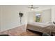 Spacious bedroom with plank flooring, a ceiling fan, and natural light at 2845 Loveland Dr # 3615, Las Vegas, NV 89109
