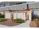 Townhouse's exterior featuring a cozy fenced patio area with flower beds at 2845 Loveland Dr # 3615, Las Vegas, NV 89109