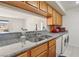 Bright kitchen featuring granite countertops, stainless steel sink and appliances, and ample cabinet space at 2845 Loveland Dr # 3615, Las Vegas, NV 89109