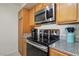 Kitchen features stainless steel appliances, granite countertops, and light wood cabinetry at 2845 Loveland Dr # 3615, Las Vegas, NV 89109