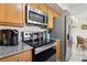 Well-equipped kitchen with stainless steel appliances and a modern cooktop stove at 2845 Loveland Dr # 3615, Las Vegas, NV 89109