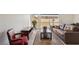 Cozy living room with wood-look flooring, comfortable seating, and natural light from the windows at 2845 Loveland Dr # 3615, Las Vegas, NV 89109