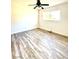 Bright bedroom features wood-look floors, a ceiling fan, and a window to bring in lots of light at 2903 Hardin Dr, Henderson, NV 89074