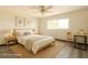 Staged bedroom features a queen bed, accent rug, furniture and window at 2903 Hardin Dr, Henderson, NV 89074