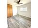 This bedroom features wood-look floors, a large window and a closet at 2903 Hardin Dr, Henderson, NV 89074